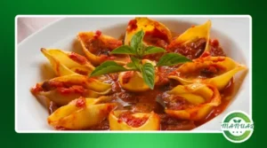 Conchiglione recheado com frango e molho de queijo